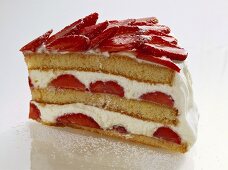 A piece of advocaat gateau with strawberries