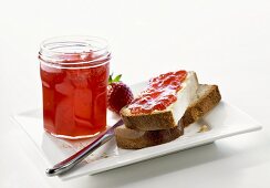 Strawberry jam in jar & on Blatz (sweet yeasted white bread)