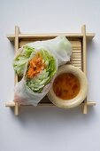 Vietnamese rice paper rolls with vegetables and dip