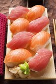 Nigiri sushi with tuna and salmon on sushi board