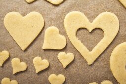 Cut-out biscuits on baking parchment