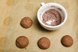 Unbaked hazelnut biscuits, cocoa and sugar mixture