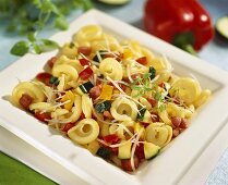 Tortellini with vegetables and diced bacon