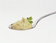 Herb mayonnaise on spoon