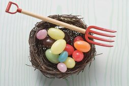 Coloured sweets in an Easter nest