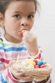 Girl with colourful Easter sweets