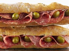 Two salami and olive baguettes