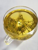 Thyme tea in a glass cup