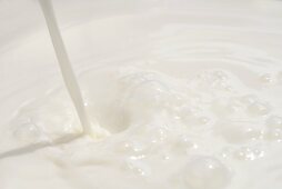 Pouring milk (full-frame)