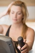 Blond woman working out on crosstrainer