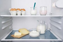 An open fridge with dairy products