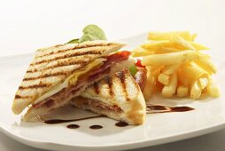 Toasted egg and bacon sandwich with chips