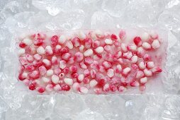 Frozen pomegrante seeds in a block of ice