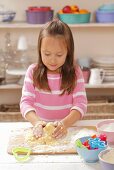 A girl kneading shortbread