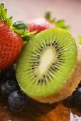 Half a kiwi fruit, blueberries and strawberries