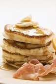 Pancakes with butter, bacon and maple syrup