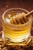 Honey dipper in a honey jar