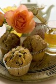 Assorted muffins on a wooden board