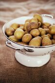 Potatoes in an enamel colander 
