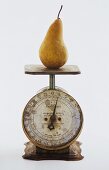 A Pear on a Metal Scale