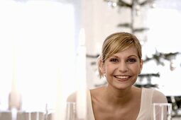 Smiling young woman at Christmas meal