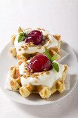 Waffles with vanilla cream and cherries