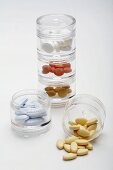 Various tablets in pill boxes