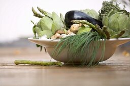 Bowl of vegetables: artichokes, aubergines, chives etc.