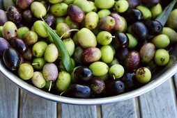 Green and black olives in a bowl