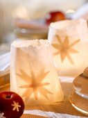 Tealights in paper bags (Christmas table decoration)