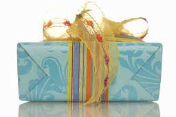 Gift tied with coloured ribbon