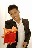 Asian man with gift