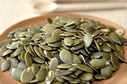 Pumpkin seeds on a terracotta plate