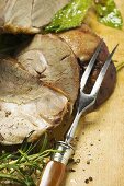 Roast leg of lamb, slices carved (close-up)