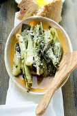 Leeks with grated cheese, white bread