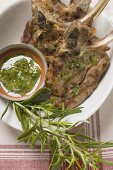 Grilled lamb cutlets with herb oil and rosemary