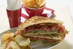BLT sandwiches, toasted, with crisps