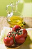 Tomatoes on the vine and olive oil