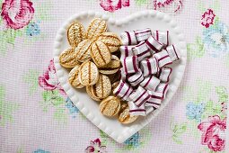 Two kinds of sweets on heart-shaped plate