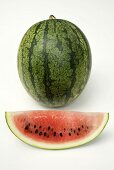 Whole watermelon and a slice of watermelon