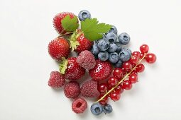 Assorted berries with leaves