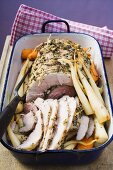 Rolled pork roast with herbs and parsley roots