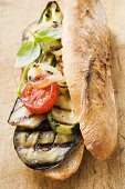 Grilled vegetables and basil in baguette