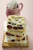 Three pieces of cherry crumble cake in a pile