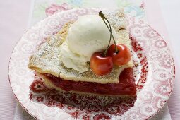 Piece of cherry pie with vanilla ice cream & fresh cherries (USA)