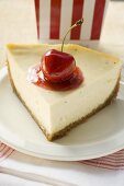 Piece of cheesecake with cherry