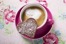 Cup of cappuccino with chocolate heart