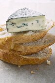 Piece of blue cheese on slices of white bread