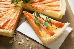 Carrot tart with parsley, a slice cut
