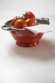 Fresh tomatoes in a colander